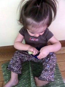 Baby Genevieve snacking on Peanut Butter apple celery dip