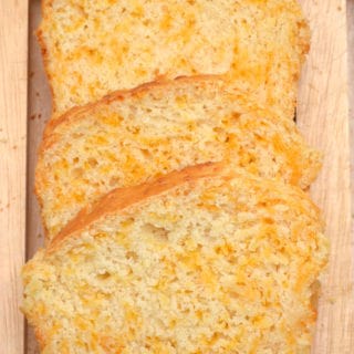A garlicky cheddar cheese quick bread ready in about an hour from start to finish. Easy, cheesy, foolproof - delicious | www.craftycookingmama.com