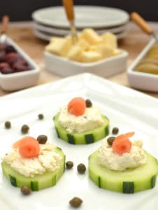 Cucumber hors d'oeuvres with Garlic & Fine Herbs Cheese, smoked salmon & capers. Simple, fancy & delicious | www.craftycookingmama.com