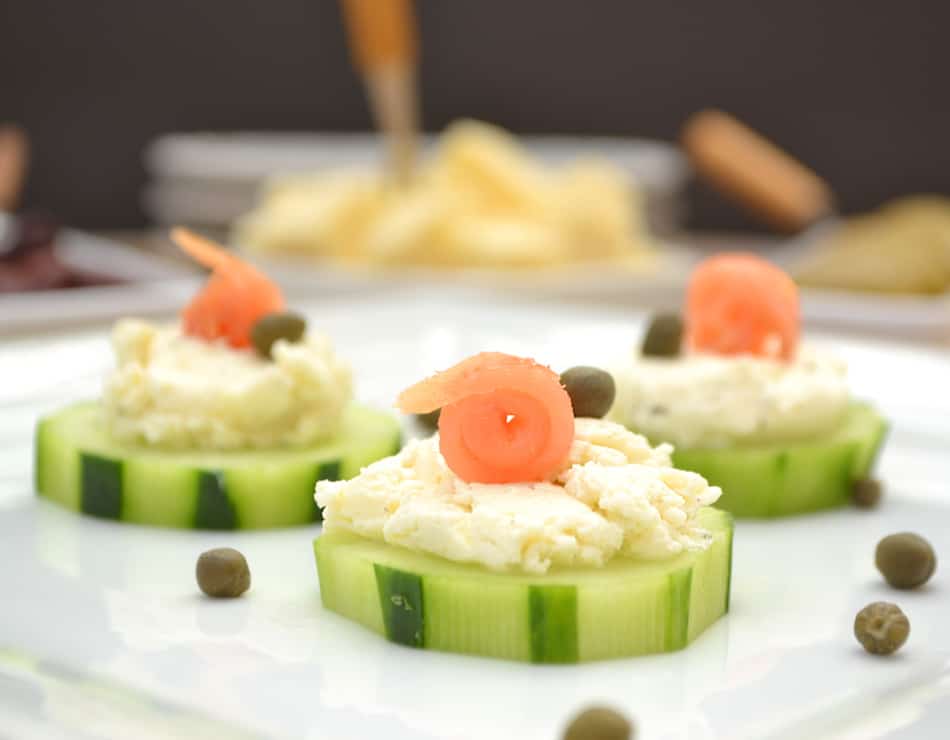 Cucumber hors d'oeuvres with Garlic & Fine Herbs Cheese, smoked salmon & capers. Simple, fancy & delicious | www.craftycookingmama.com