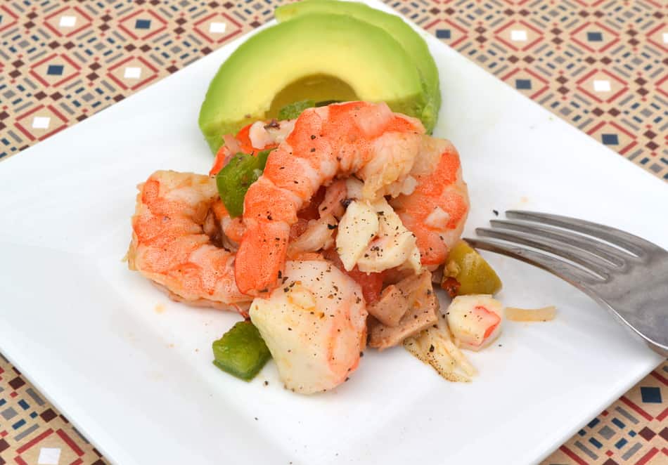 Spanish Seafood Salad with shrimp, crab, octopus, veggies & olives. Loaded with fresh, bold flavor & just the right amount of heat | www.craftycookingmama.com