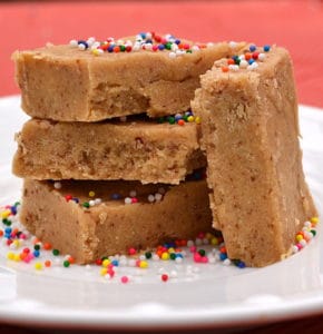 These Low Carb Peanut Butter Cream Cheese Protein Bars taste like a healthy Peanut Butter Cheesecake!  Quick & simple to make - one bowl, no baking & no food processor | www.craftycookingmama.com