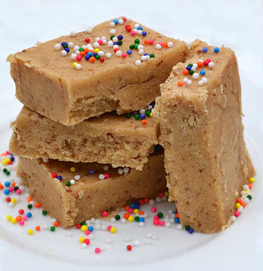 These Low Carb Peanut Butter Cream Cheese Protein Bars taste like a healthy Peanut Butter Cheesecake!  Quick & simple to make - one bowl, no baking & no food processor | www.craftycookingmama.com