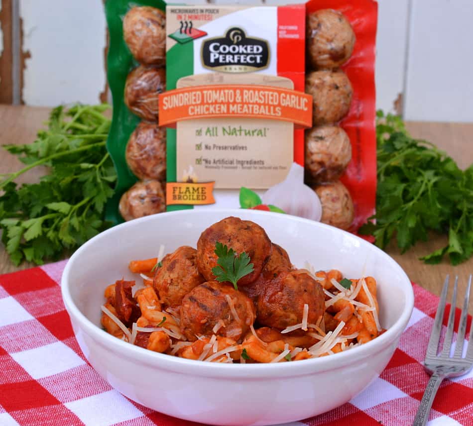 This quick, delicious & hearty one pot pasta & meatball recipe is perfect for all your busy nights!  Get dinner on the table in less than half an hour | www.craftycookingmama.com