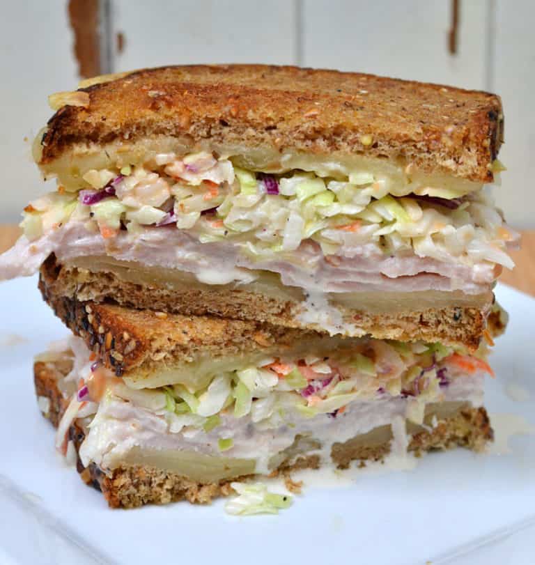 The Rachel Sandwich grilled with swiss cheese and topped with turkey