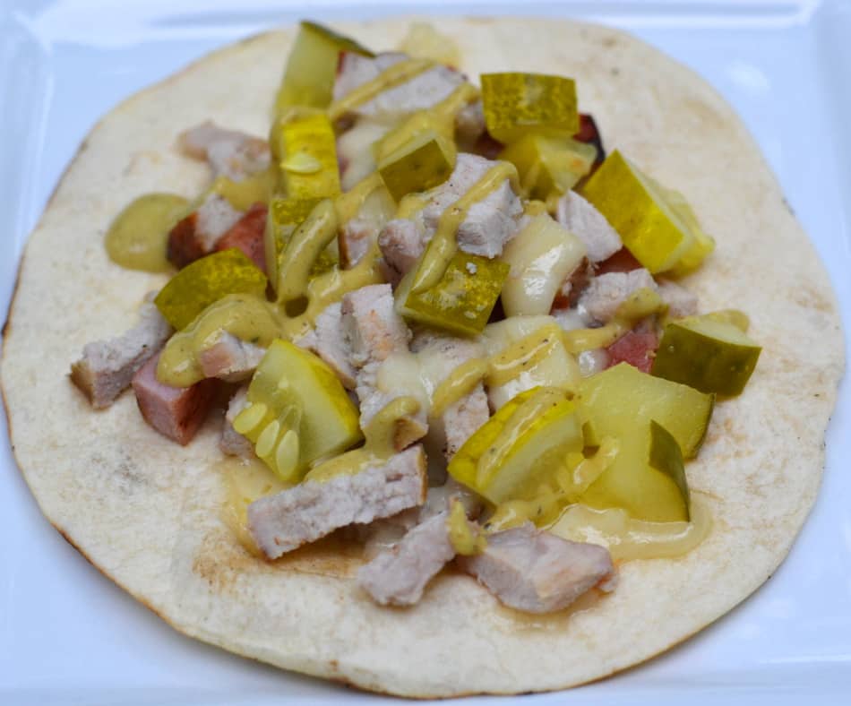 These Cuban Tacos are a fun, quick & delicious summer meal. Cooked on the grill with Hatfield® Pork tenderloin, ham steaks, pickles & Swiss cheese - it's an exciting taco fusion!