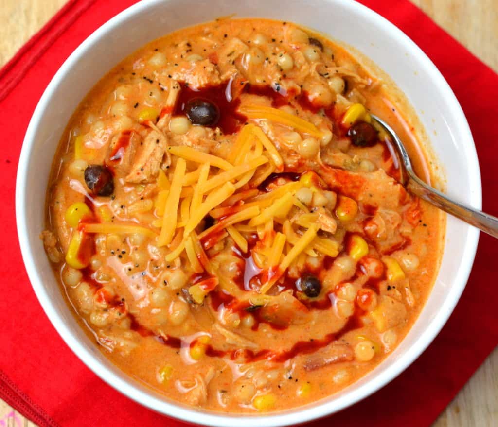 Bowl of Buffalo Chicken Chili with Hot Sauce & Shredded Cheese