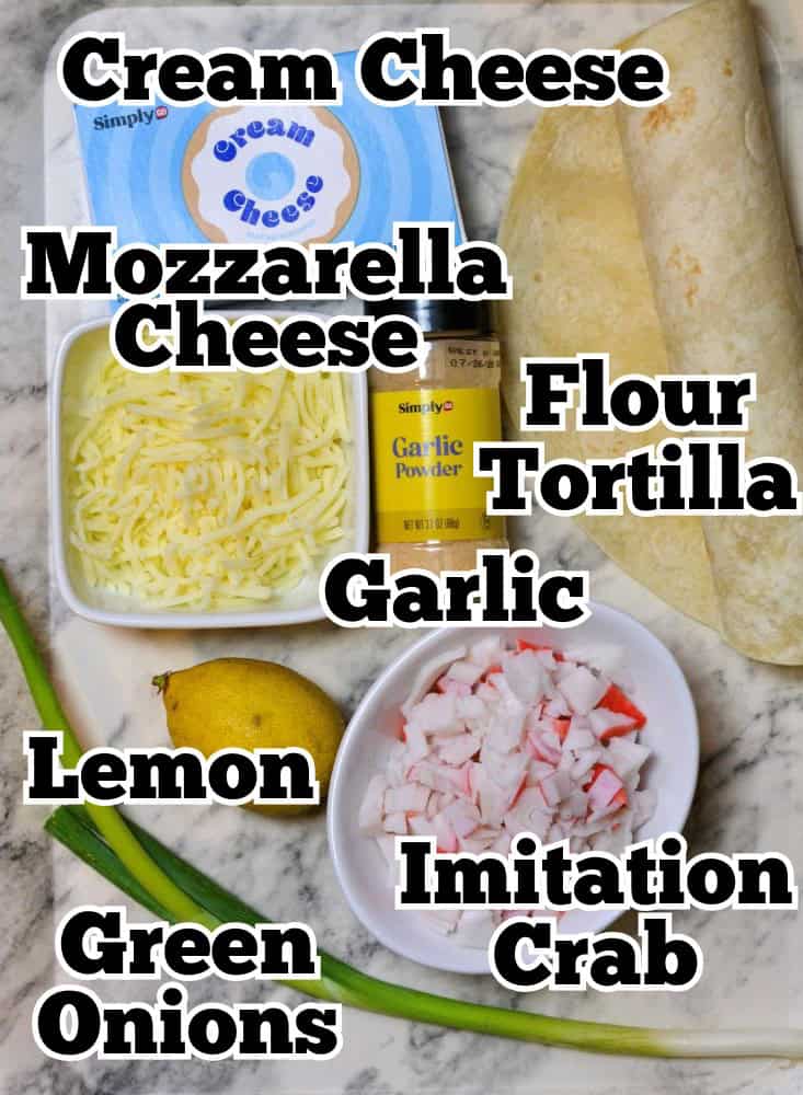 Ingredients pictured for Crab Rangoon Quesadilla : Cream Cheese, Mozzarella Cheese, Flour Tortillas, Garlic Powder, Lemon Juice, Green Onions and Imitation Crab.